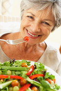 senior woman eating healthy salad